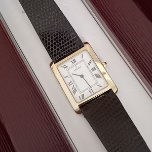 14 karat gold very unique Movado tank watch, genuine lizard strap